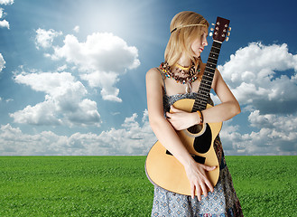 Image showing hippie girl with the guitar outdoor