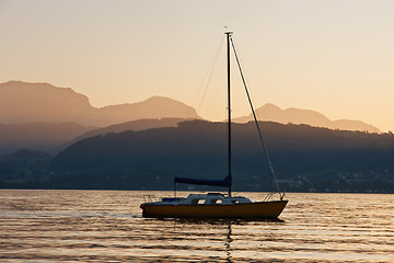 Image showing Solitary yacht on the lake in a sunset
