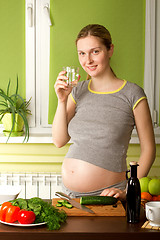 Image showing pregnant woman on kitchen