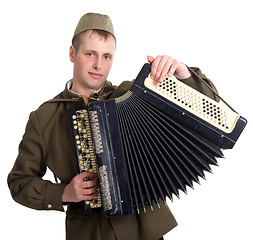 Image showing A soldier plays the accordion