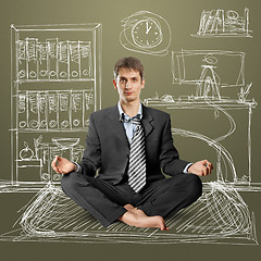 Image showing businessman in lotus pose