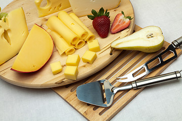 Image showing A set of cheese on a wooden board