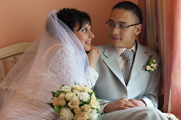 Image showing The bride and groom in their room before the wedding