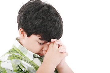 Image showing A boys prays earnestly to his creator in heaven 