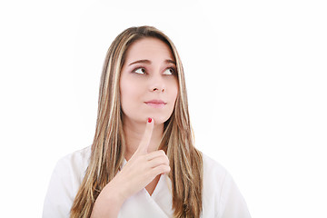 Image showing Thinking woman looking up, isolated on white