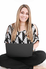 Image showing Woman with a laptop computer - isolated over a white background 