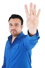 Image showing young good looking man with counting fingers against white backg