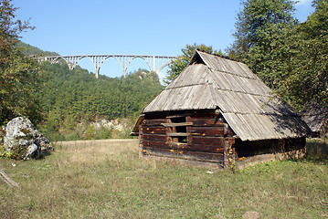 Image showing Wooden hut and bridge