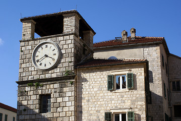 Image showing Clock tower and house 