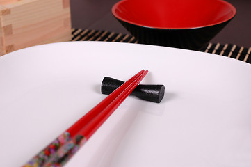 Image showing Chopsticks on white plate