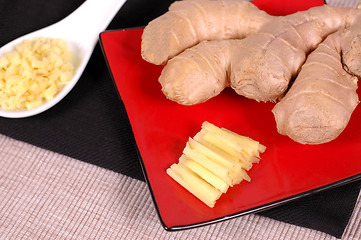 Image showing Ginger hand with minced and sliced ginger
