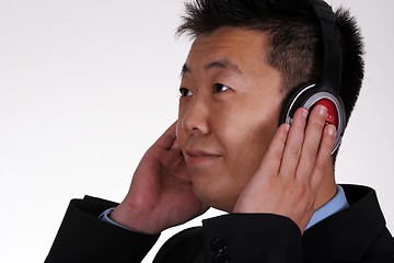 Image showing Asian businessman listening