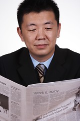 Image showing Asian Businessman Reading