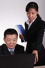 Image showing Asian Executive and Secretary