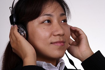 Image showing Asian businesswoman listening