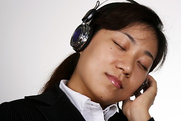 Image showing Asian businesswoman listening