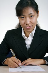 Image showing Asian Businesswoman Writting