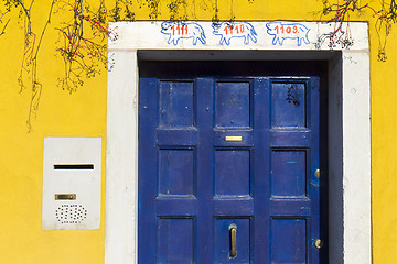 Image showing Blue door and yellow wall