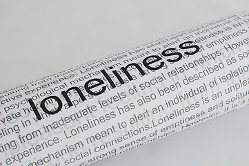 Image showing Typed text Loneliness on paper