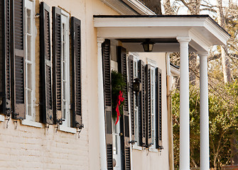 Image showing Cream colored house with xmas wreath