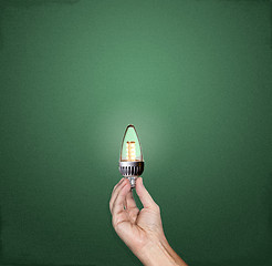 Image showing Bright idea LED lightbulb in hand