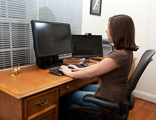 Image showing Woman at computer desk