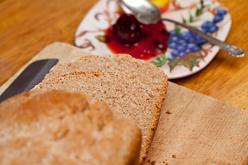 Image showing Sliced wheat bread and jam