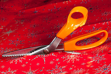 Image showing Pinking shears or scissors cutting