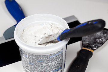 Image showing Spackling knive in plaster