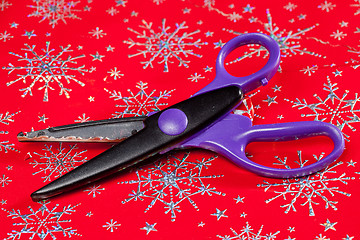 Image showing Pinking shears or scissors cutting