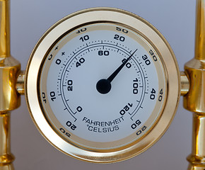 Image showing Gold colored thermometer