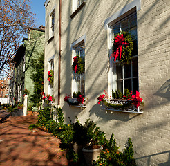 Image showing Cream colored house with xmas wreath