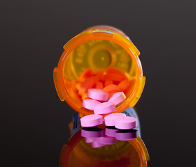 Image showing Purple pills from orange drug bottle