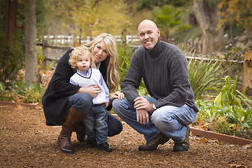 Image showing Young Attractive Parents and Child Portrait in Park