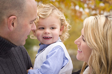 Image showing Young Attractive Parents and Child Portrait in Park
