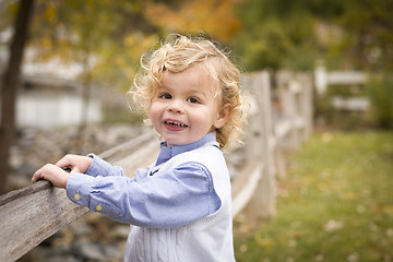 Image showing Adorable Young Boy Playing Outside