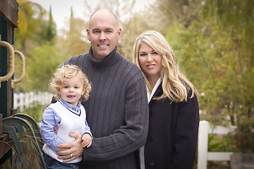 Image showing Young Attractive Parents and Child Portrait in Park