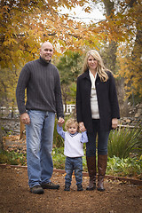 Image showing Young Attractive Parents and Child Portrait in Park