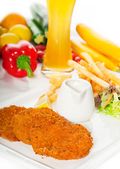 Image showing classic Milanese veal cutlets and vegetables