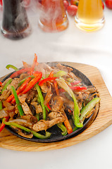 Image showing original fajita sizzling hot  on iron plate