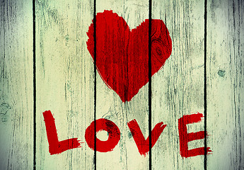 Image showing love symbol on old wooden wall