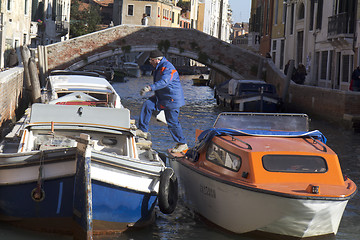 Image showing Workman on a boat