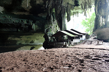 Image showing Wooden house in cave