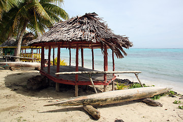 Image showing Huts and boat