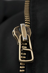 Image showing Closed yellow metal zipper