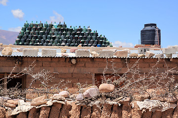 Image showing House and wine bottles