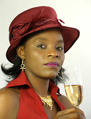 Image showing Black woman drinking wine