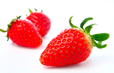 Image showing Three stawberries on the white background 