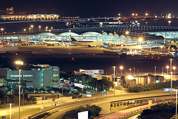 Image showing Freeway in night with cars light in modern city. 