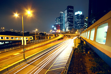 Image showing urban landscape at night and through the city traffic 